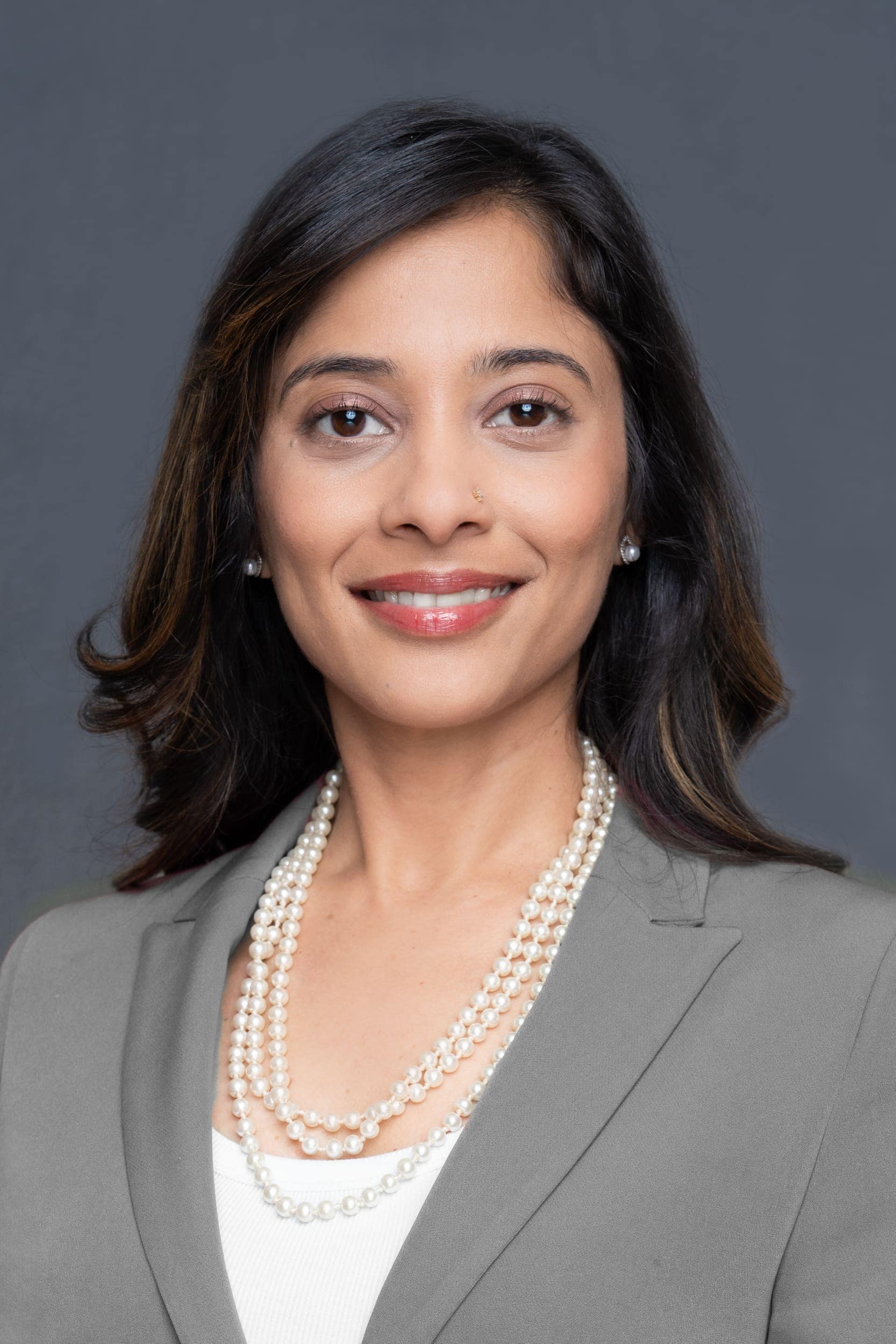 Female-HR-Headshot-Sydney-NSW Int: Young Indian woman in grey jacket having Business head shot taken by headshot photographer Georgie Greene in Sydney NSW