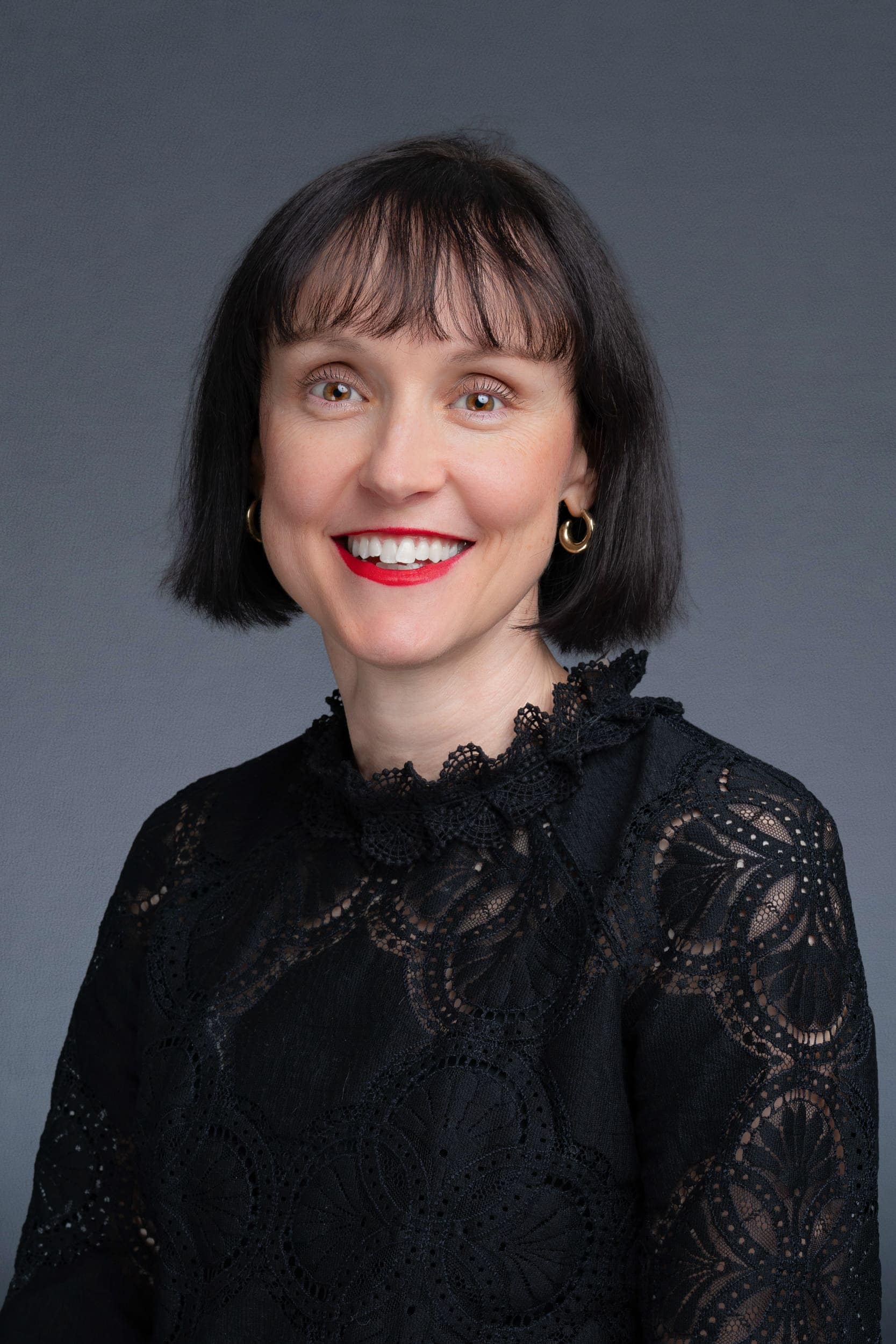 Professional-Headshots-Sydney-NSW Older woman wearing a black shirt having corporate headshots taken by Sydney Photographer Georgie Greene in Sydney NSW