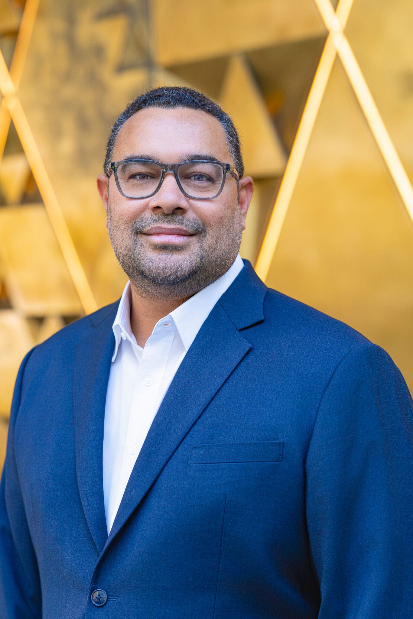 Male Finance manager wearing a blue suite and having his professional headshot taken by Sydney headshot photographer Georgie Greene