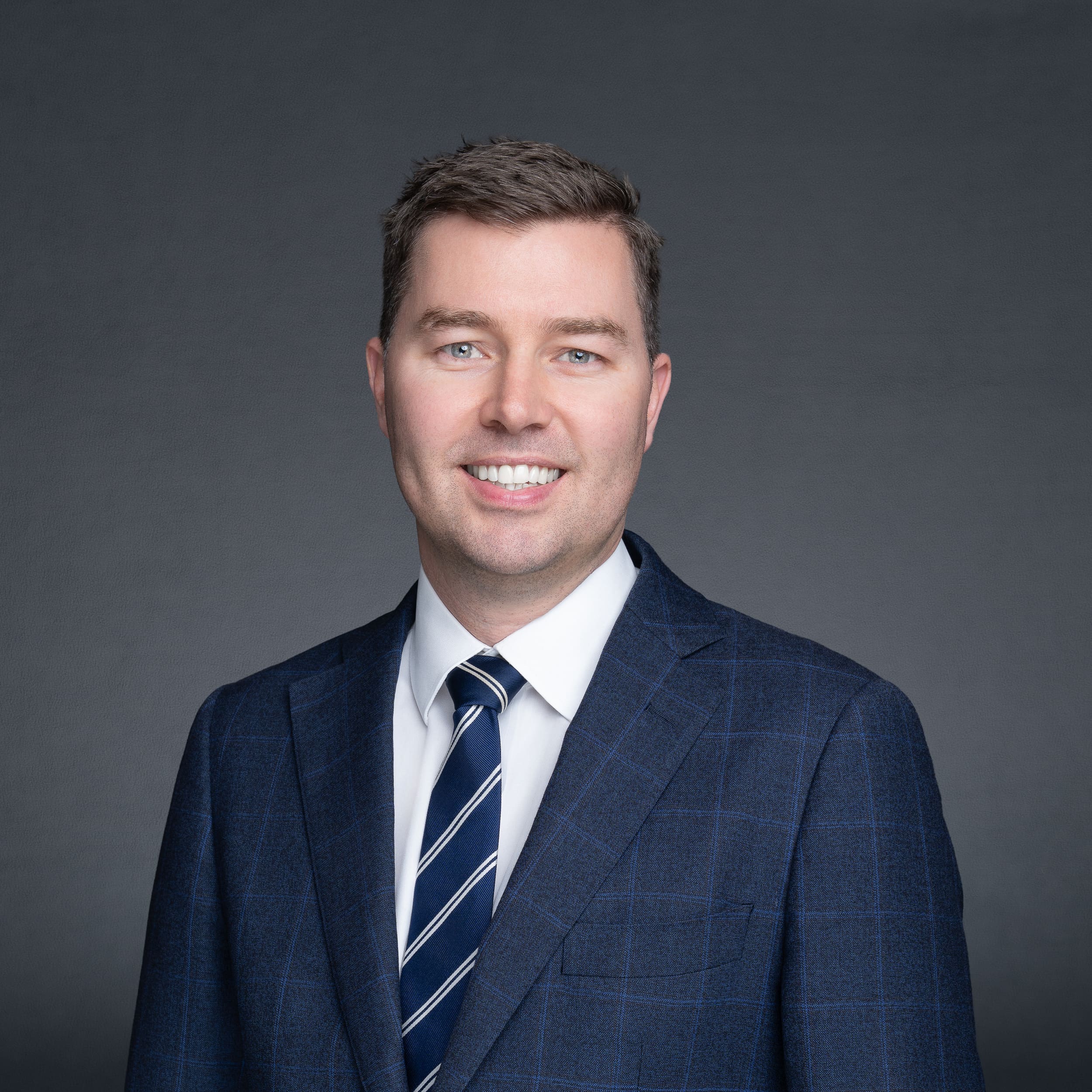 Sydney-Legal-Headshot-NSW Male Lawyer wearing blue and having his business headshot taken by Sydney headshot photographer Georgie Greene