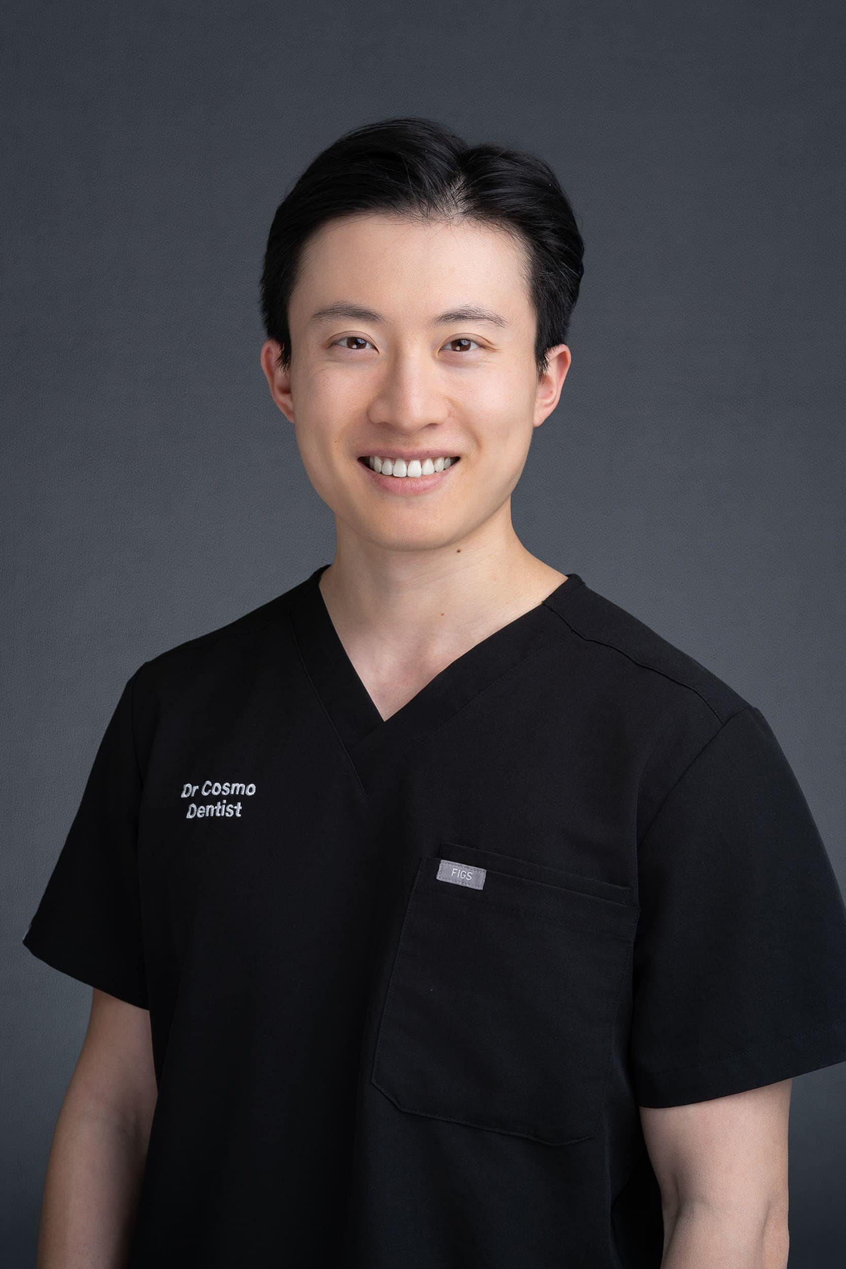 Dentist-Headshot-Sydney-NSW Young Asian Dentist wearing his medical scrubs having his headshot taken by Sydney headshot photographer Georgie Greene