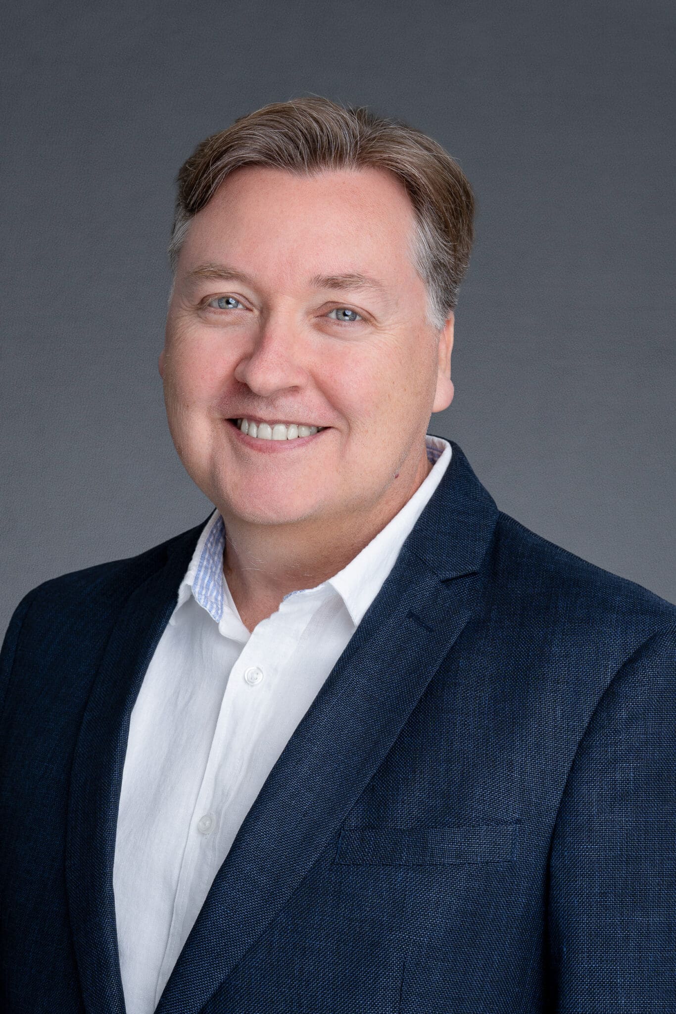 Middle-aged man wearing a blue suit having his headshot taken by Sydney headshot photographer Georgie Greene