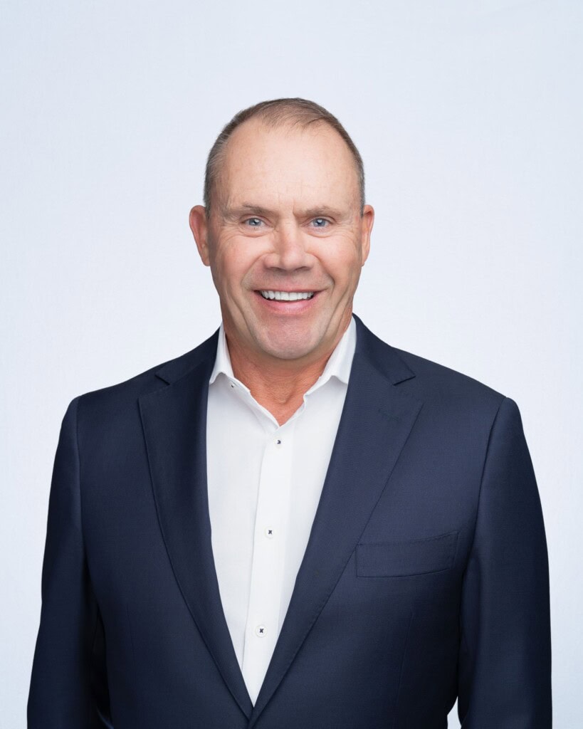Older man wearing a blue jacket having his company headshot taken by Sydney headshot photographer Georgie Greene