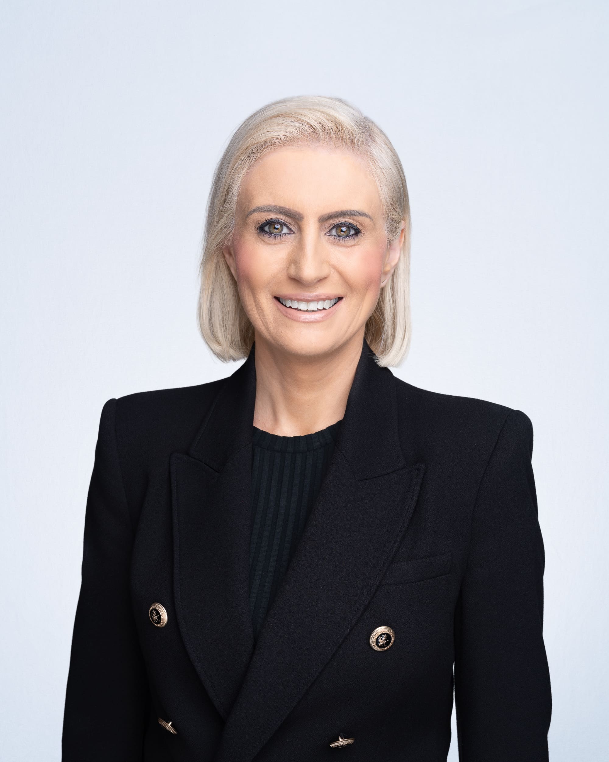 Sydney-Company-Headshot-NSW Young woman wearing a black blazer having her company headshot taken by Sydney corporate photographer Georgie Greene