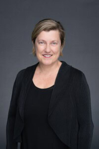 Admin-Headshot-Sydney-NSW – Professional Photographer Sydney Older woman with blonde hair in a black blouse having her headshot taken by Sydney portrait photographer Georgie Greene