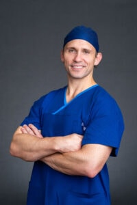 Surgeon-Headshot-Sydney-NSW – Professional Photographer Sydney Sydney headshot of young orthopedic surgeon wearing his blue scrubs