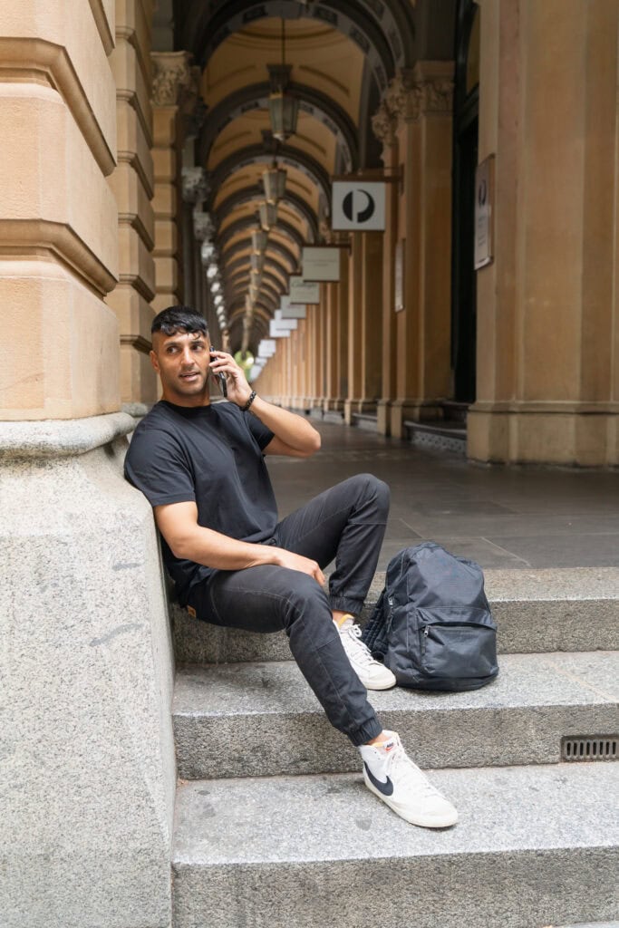 Indian man on the phone having his dating photos taken by Sydney dating photographer Georgie Greene