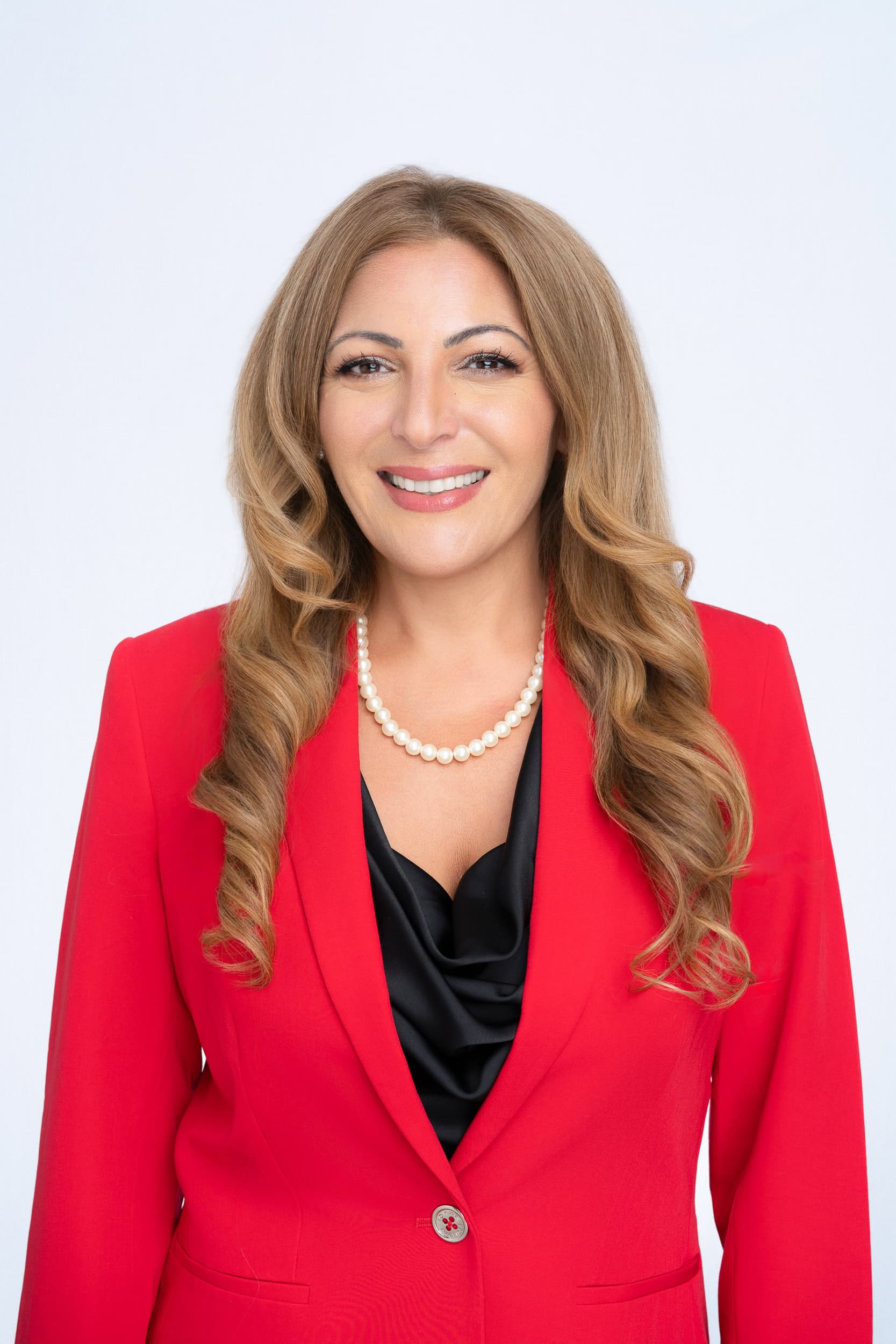 Solicitor-Headshot-Sydney Blonde woman wearing a red jacket having her headshot taken by Sydney headshot photographer Georgie Greene