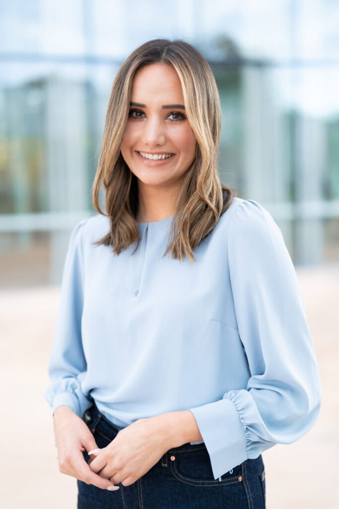 Sydney-Professional-Photographer Young woman with a blue top having her headshot taken by Sydney professional photographer Georgie Greene