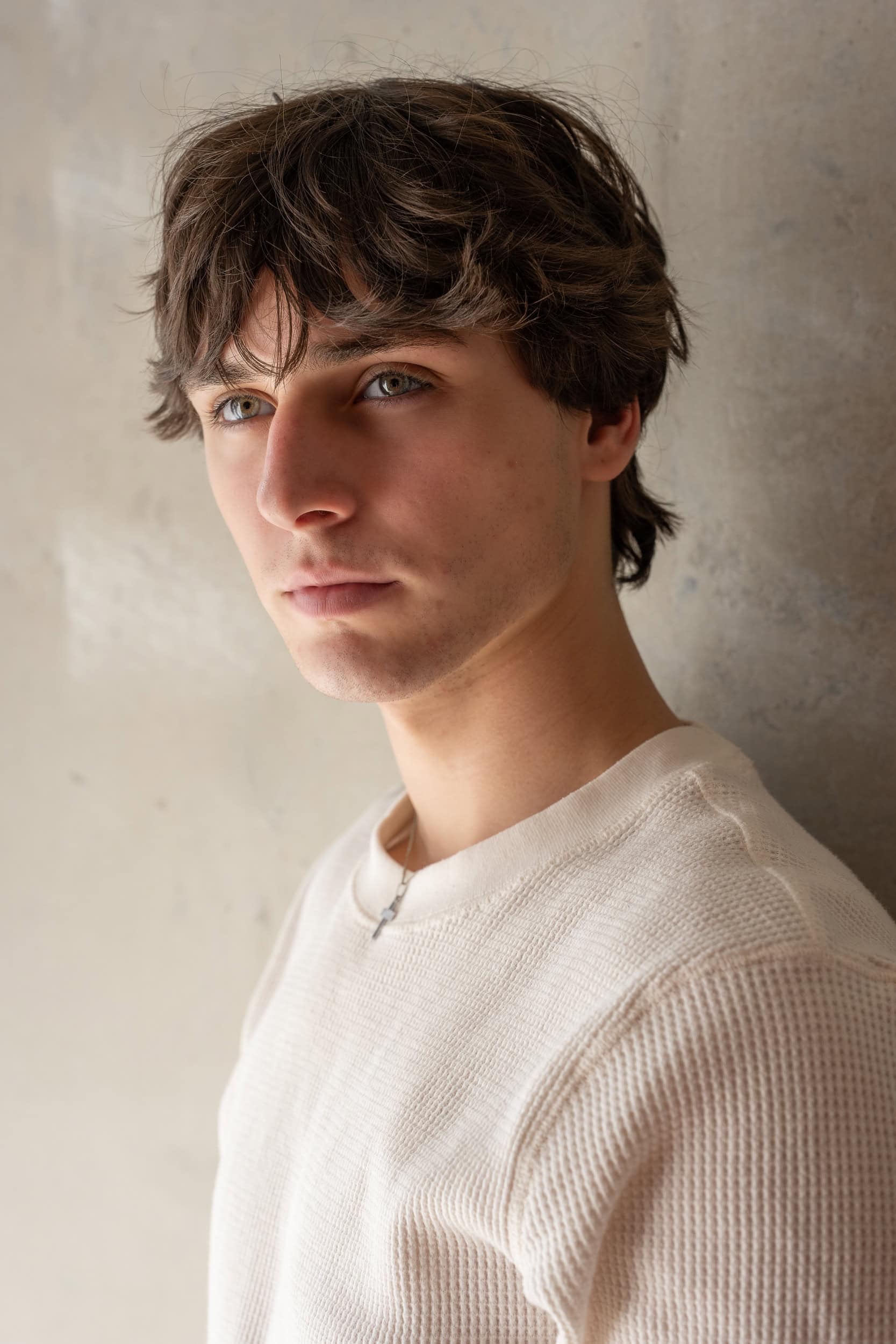 young dark haired man wearing a cream jumper having his dating photo taken by Sydney professional dating photographer Georgie Greene