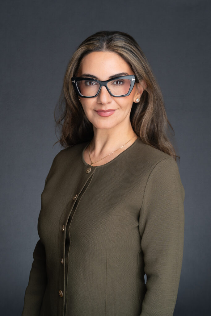 Sydney-Barrister-Headshot young female barrister wearing a green suit and funky glasses having her professional headshot taken by Sydney photographer Georgie Greene