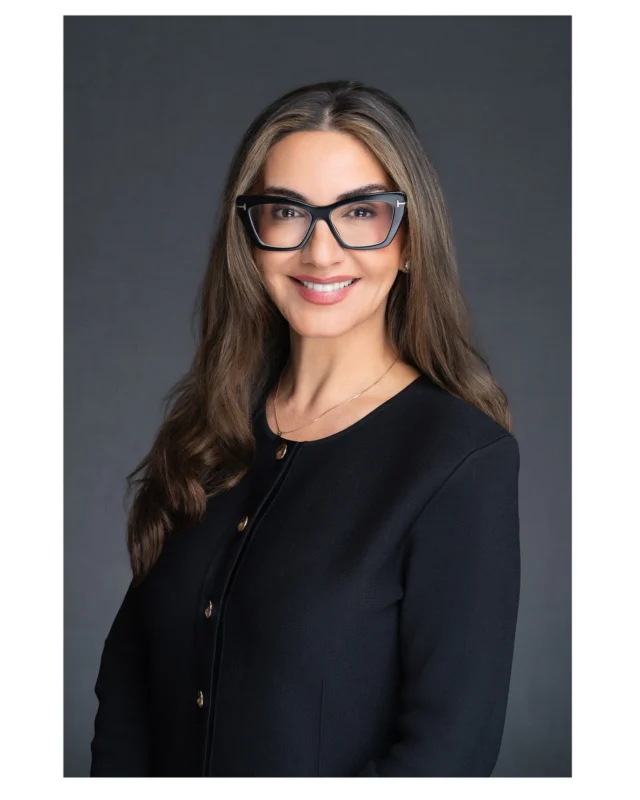Love the glasses on this headshot. They can really show your identity.